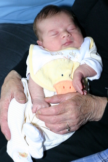 Mom holding her first great-grandchild Aidan.